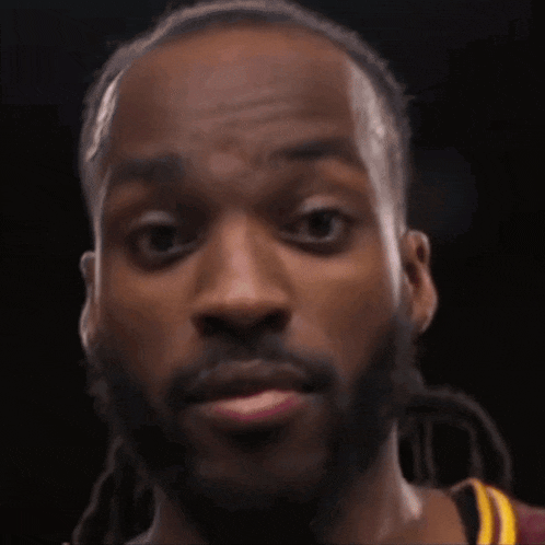 a close up of a man wearing a red and yellow jersey with the word a10 on it