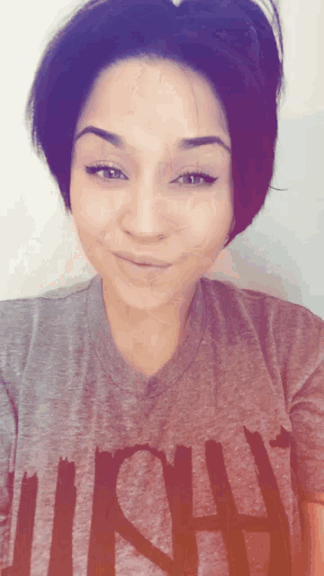 a woman wearing a shirt that says lush