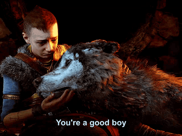 a man petting a wolf with the words you 're a good boy below him