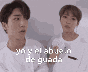 two young men are standing next to each other with the words yo y el abuelo de guada on the bottom .