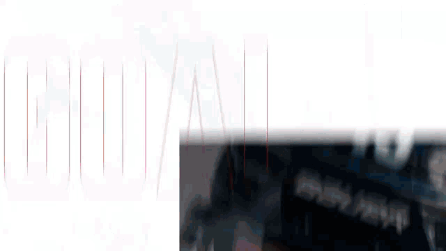 a blurry picture of a person 's face with a white background and red lines