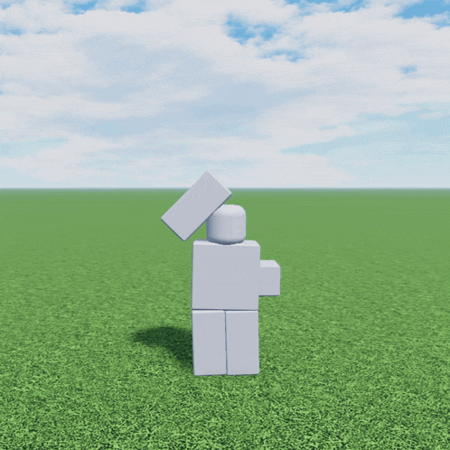 a white lego figure is standing in a field