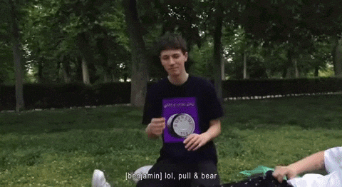 a young man wearing a purple shirt that says jonathan me and emilio walked past it before it is terrible