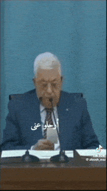 a man in a suit and tie with an ostrich face on his face
