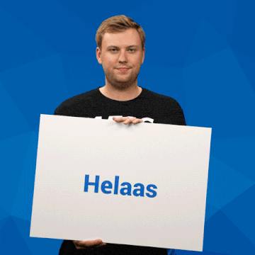 a man holding a sign that says helaas