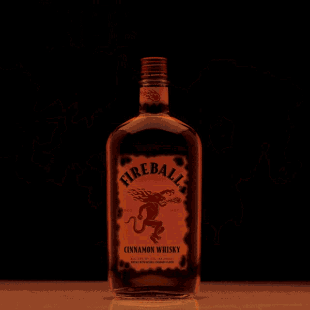 a glass container is filled with a bright orange flame
