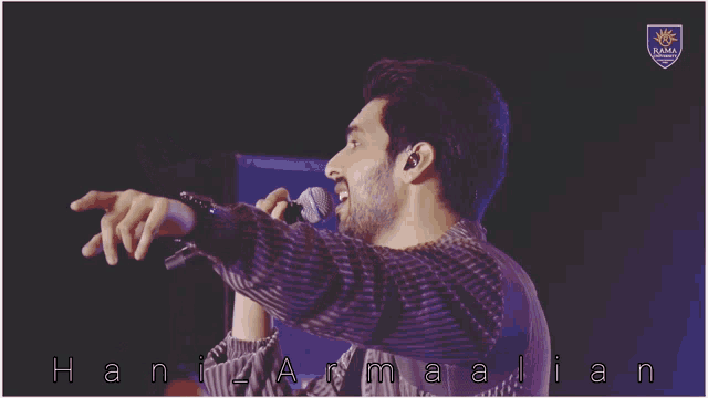 a man singing into a microphone with the name hani armalian written on the bottom