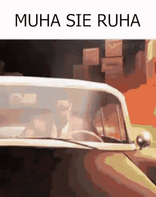 a man is driving a car with the words muha sie ruha on the bottom