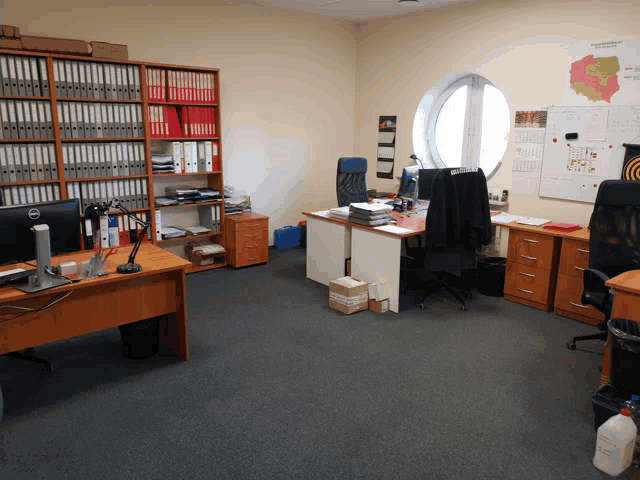 an office with a map on the wall that says ' polska ' on it