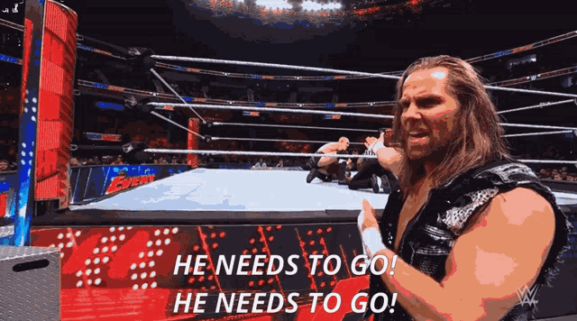 a man in a wrestling ring with the words he needs to go behind him