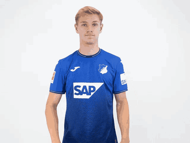 a man wearing a blue shirt that says sap