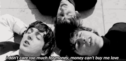 a black and white photo of three men laying on the floor with the caption i don t care too much for money