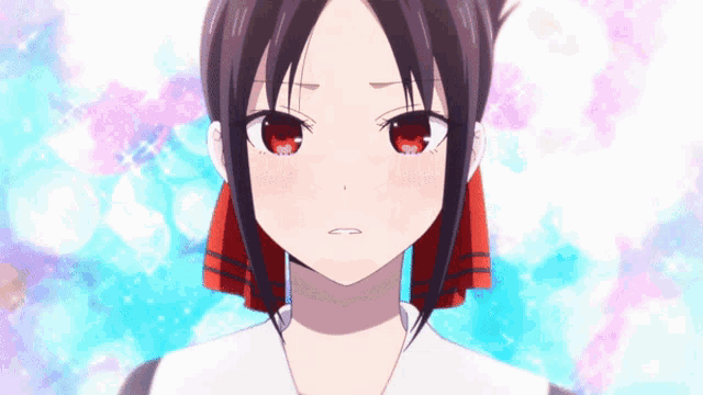 a close up of a girl 's face with red eyes