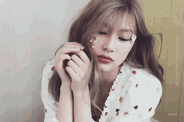 a woman with flowers on her face and the words after the mini album one & six
