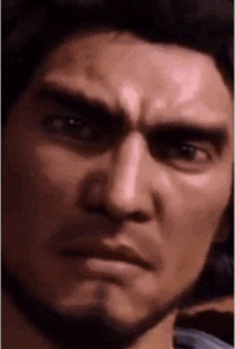 a close up of a man 's face with a serious expression