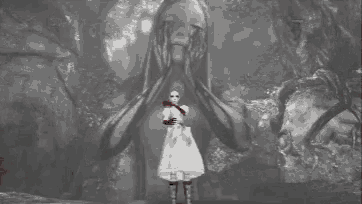 a girl in a white dress is standing in front of a giant statue