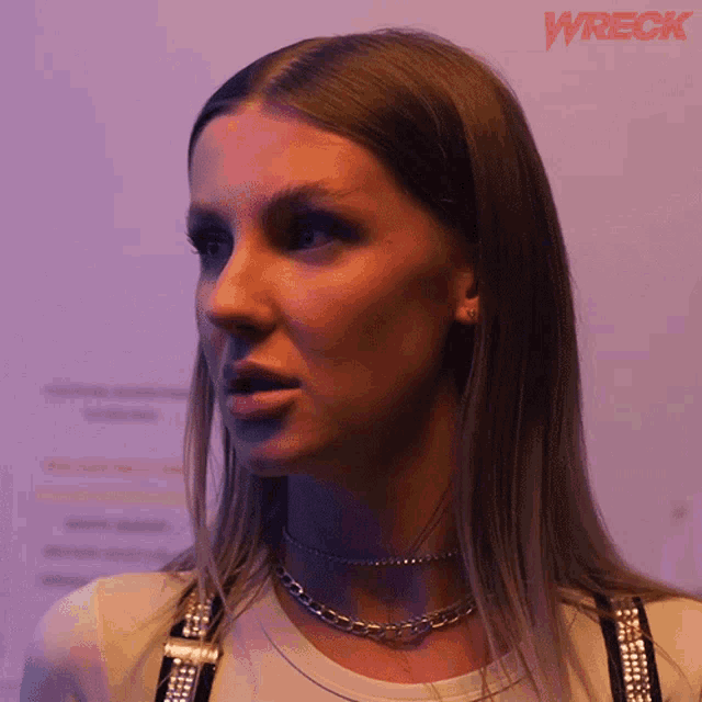 a close up of a woman 's face with the word wreck in the corner