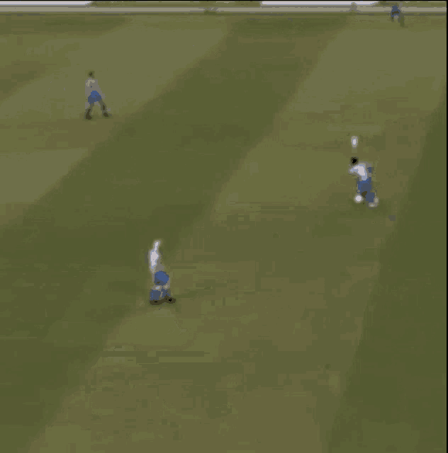 a soccer game is being played on a field with fifa.com banners on the sidelines