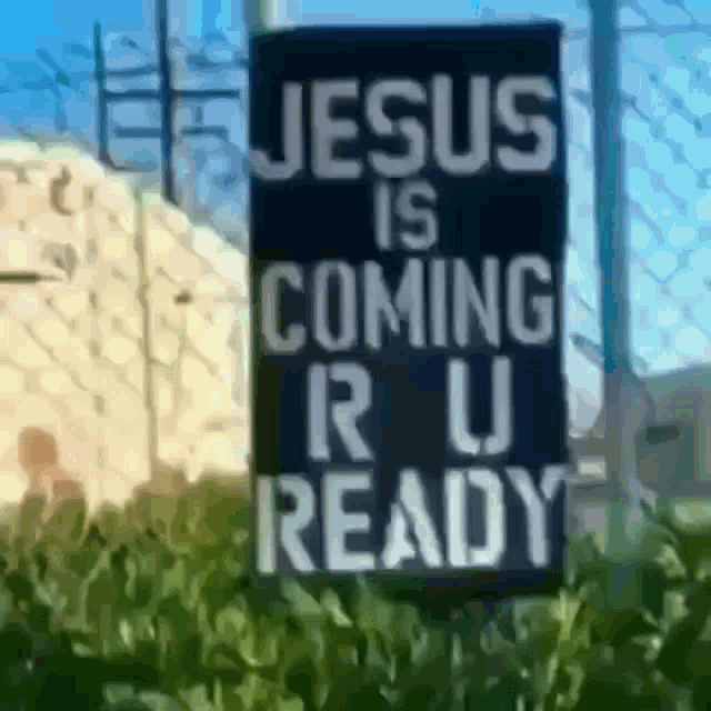 a sign that says jesus is coming r u ready in white letters