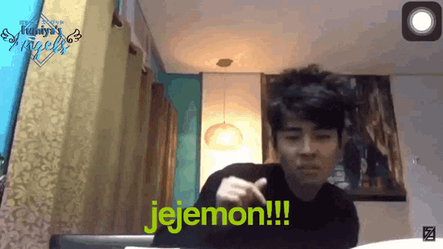 a man in a black shirt says " jejemon " in yellow letters