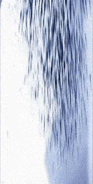 a close up of a waterfall with a blue background
