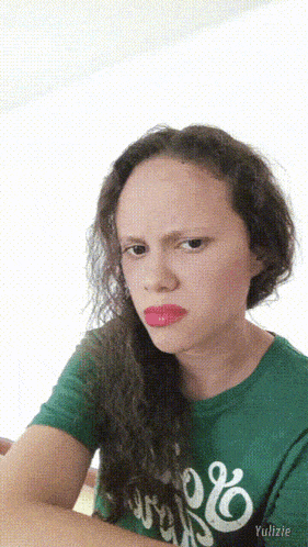 a girl wearing a green shirt that says ' yulizie ' on the bottom