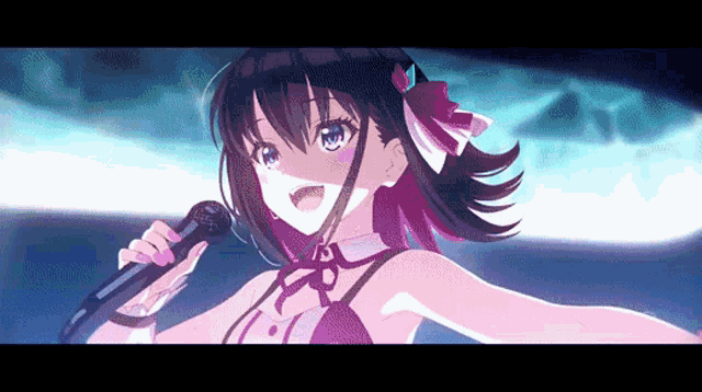 a girl with purple hair is singing into a microphone on stage .