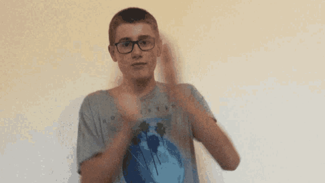 a boy wearing glasses and a hollister shirt