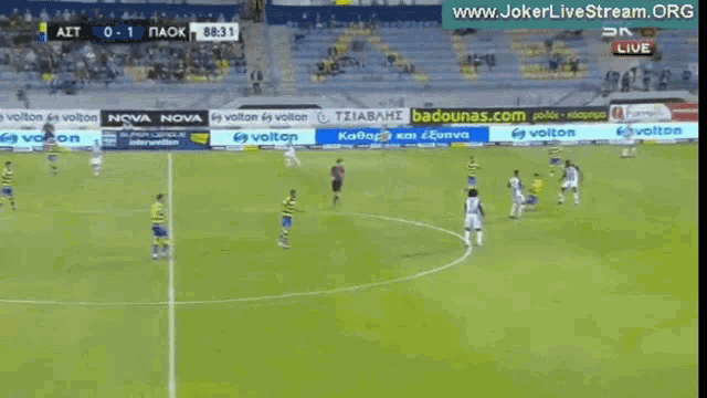 a soccer game is being played in a stadium sponsored by nova nova