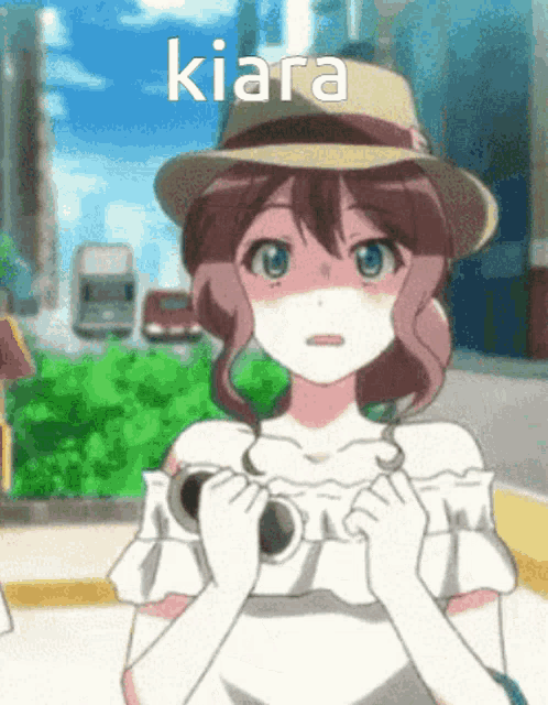 a girl wearing a straw hat and sunglasses has the name kiara above her head