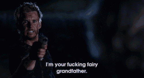 a man is pointing a gun and saying i 'm your fucking fairy grandfather .