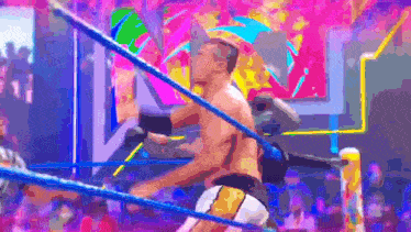a man in a wrestling ring with a crowd watching