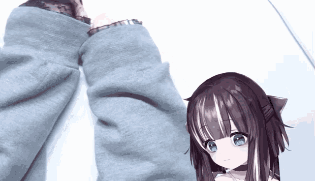a girl with dark hair and blue eyes is standing next to a person wearing a grey shirt
