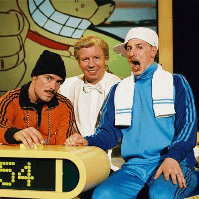 three men are sitting next to each other in front of a clock that says 3:41 .