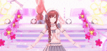 a girl is standing on a stage with her arms outstretched in front of flowers .
