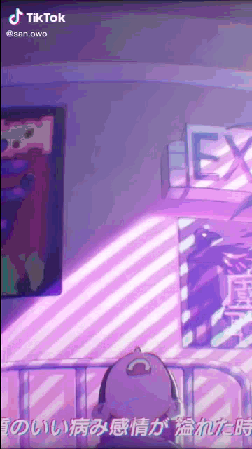 a cartoon character is sitting on a bed in a room with a purple background .