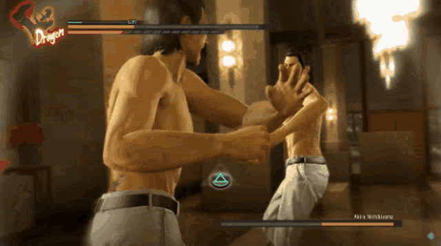 two men are fighting in a video game with the word dragon visible