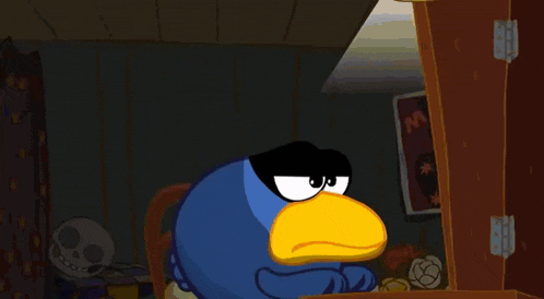 a blue bird with a yellow beak and black eyes is making an angry face