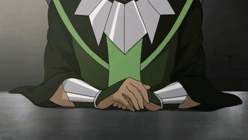 a person with their hands folded wearing a green and white outfit