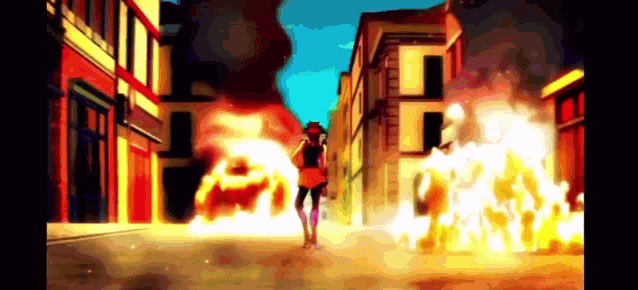 a person is walking down a street in front of a building that is on fire .