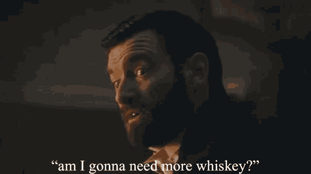 a man with a beard is talking about whiskey
