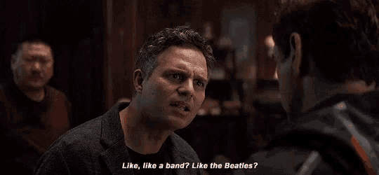 a man is talking to another man in a bar and says `` like , like a band , like the beatles ? ''