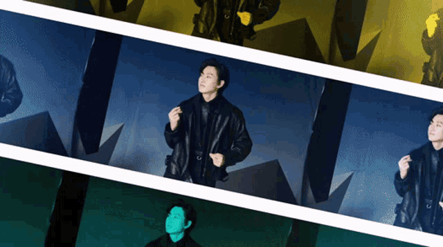 a man in a black leather jacket is standing in front of a pyramid