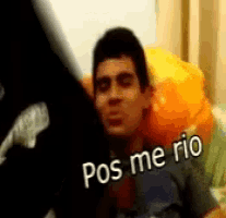 a man sitting on a couch with the words pos me rio on his face
