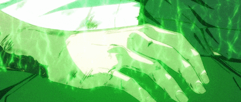 a close up of a person 's hand with a green light coming out of it