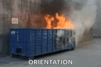 a dumpster is on fire and the word orientation is above it