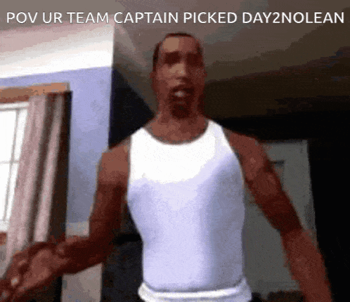 a man in a white tank top with the words pov ur team captain picked day2nolean on the bottom