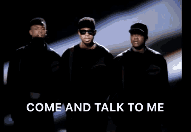 a group of men standing next to each other with the words come and talk to me above them