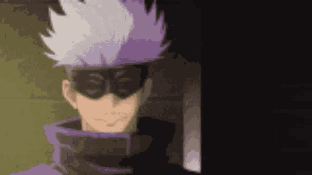 a close up of a person wearing a mask and a purple shirt .