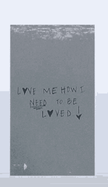a gray background with the words love me how i need to be loved